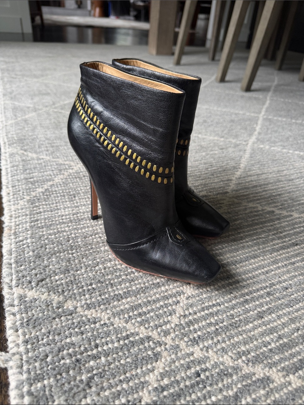 Black Leather High-Heel Ankle Boots with Gold Accent
